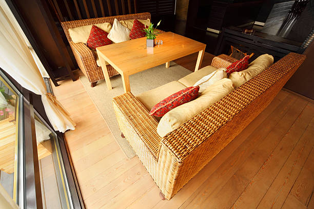 istock Two wicker couches with pillows and table in restaurant 147783762