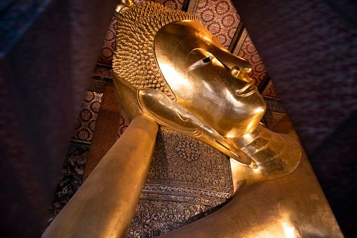 Golden Buddha statue at Wat Pho Temple in Bangkok