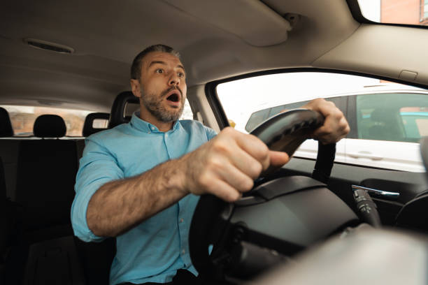 istock Scared man driving car, had an accident 1477841089
