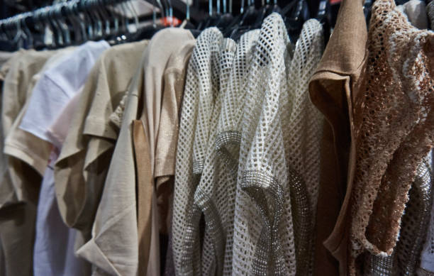 istock shirts hanging in a store 1477841308
