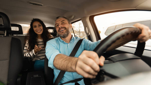 istock Happy couple enjoying drive on new car 1477841382