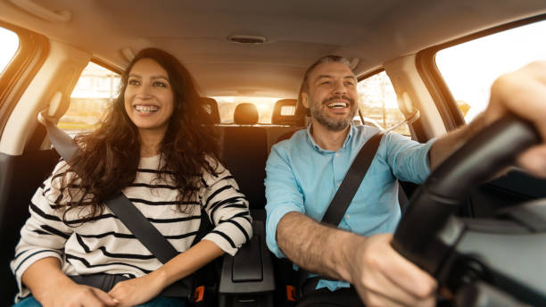 istock Happy couple enjoying drive on new car 1477841664
