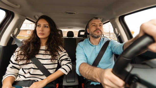 istock Serious Couple Driving Sitting In Automobile Enjoying Trip, Panorama 1477841686