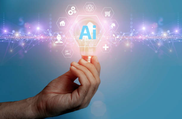 istock Ai technology concept. Man hold bulb with holographic interface business analytics and global technology. 1477843902