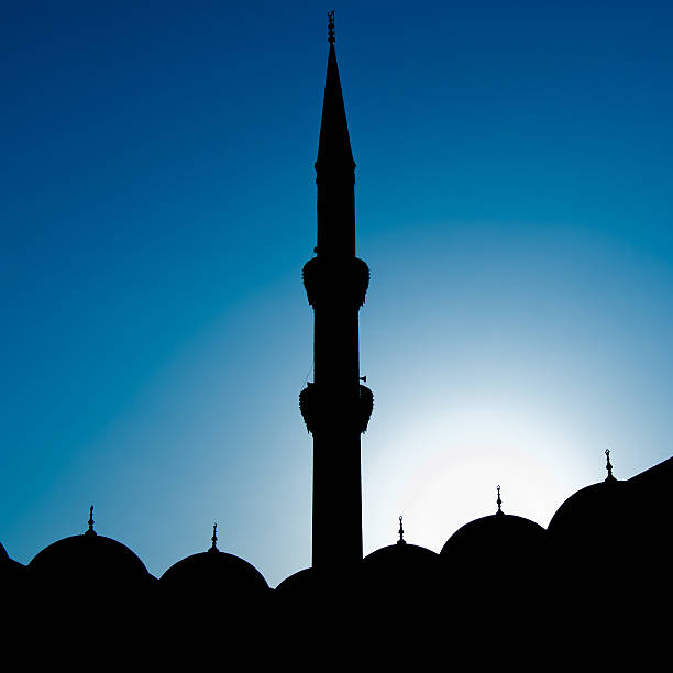 istock The minaret of mosque in a blue sky 147784783