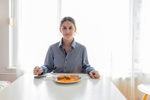 The resilience and positivity of the teenage girl as she faces food insecurity. Despite the challenges she may face, she remains thankful for the food in front of her and determined to overcome the situation.