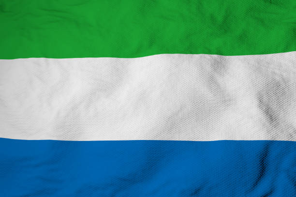 Full frame close-up on a waving flag of Sierra Leone in 3D rendering.