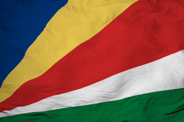 Full frame close-up on a waving flag of the Seychelles in 3D rendering.