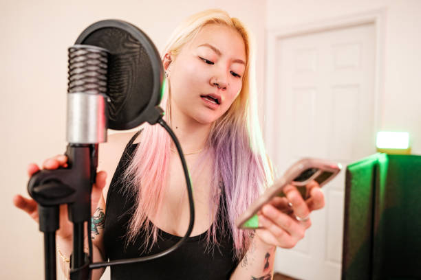 istock Female Korean Musician practising at home recording studio 1477853740