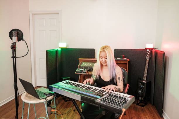 istock Female Korean Musician practising at home recording studio 1477854451