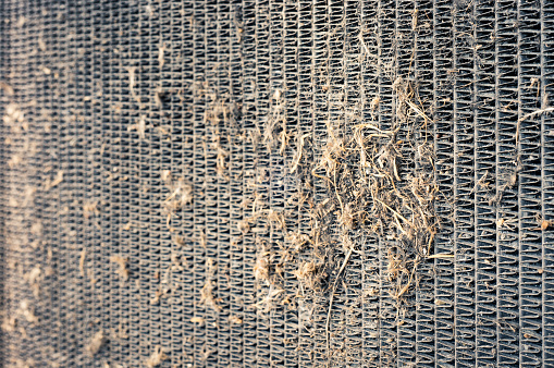 Close up of the clogged and dirty vehicle radiator