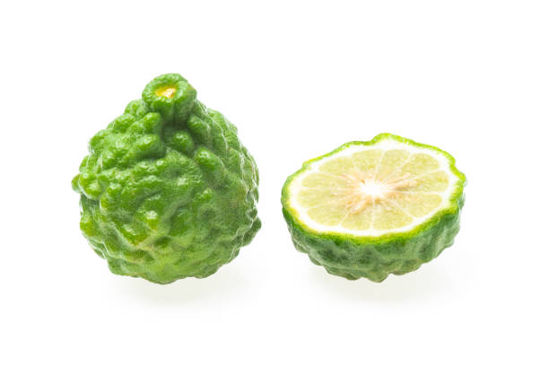 istock Fresh bergamot fruit and half piece isolated on white background ( Kaffir lime, Citrus, Rutaceae. ) 1477858396