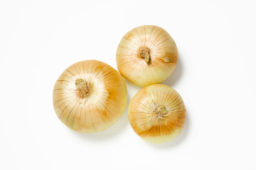 Vidalia onions on a white surface
