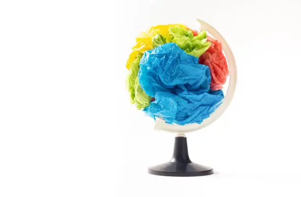 Globe made from the plastic bag, Concept idea is plastic garbage is overflow on the world