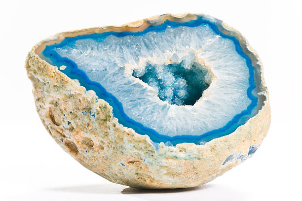 istock Close-up of a blue agate with hole in the middle, on white 147786327