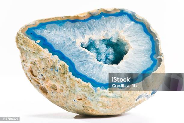 Closeup Of A Blue Agate With Hole In The Middle On White Stock Photo - Download Image Now