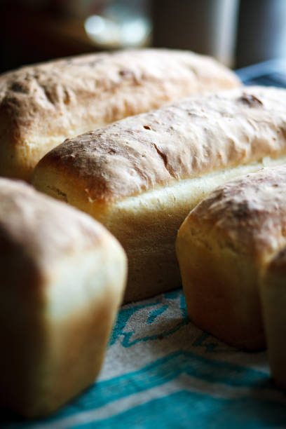 istock Freshly baked homemade bread is on the table. 1477864003