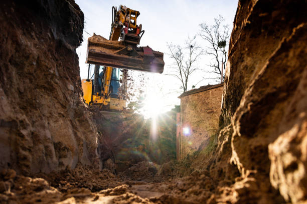istock Excavator at work seen from inside the trench 1477864201