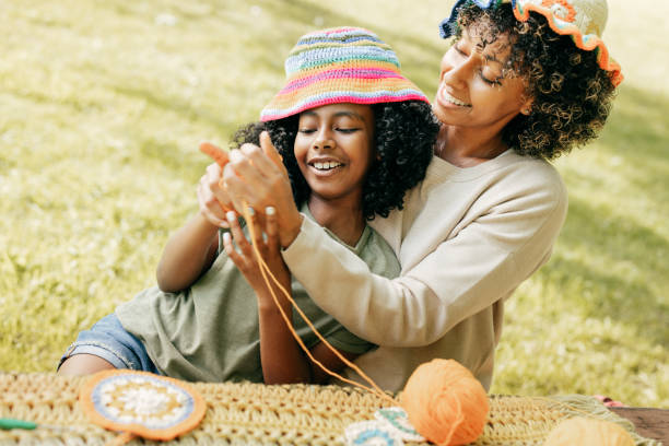 istock mom and daughter crochet together 1477864751