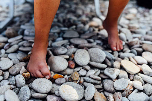 Walking barefoot strengthens the muscles in children's feet and ankles, improving balance and posture and foster a connection with nature.