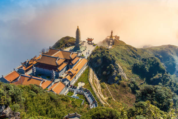 beautiful view from fansipan mountain with a buddhistic temple. sa pa, lao cai province, vietnam. - lao cai province bildbanksfoton och bilder