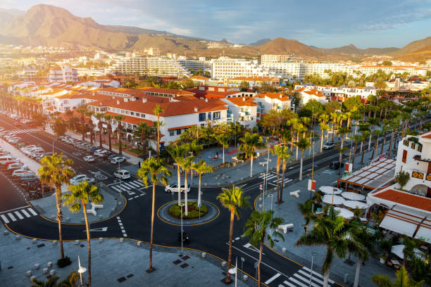 sunset cityscape of playa de las americas holiday resort streets in tenerife. canary islands, spain - playa de las américas imagens e fotografias de stock