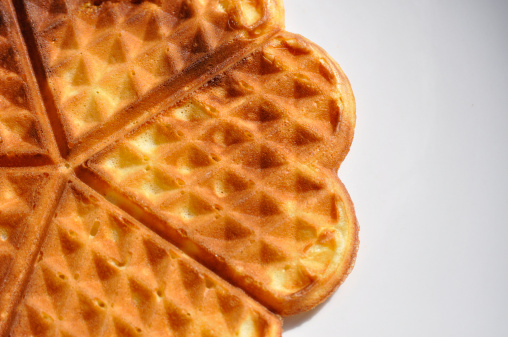 Heart-shaped waffles on a white background.