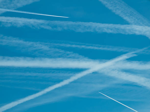 istock Zickzag pattern of many airplane contrails in the sky 147786893