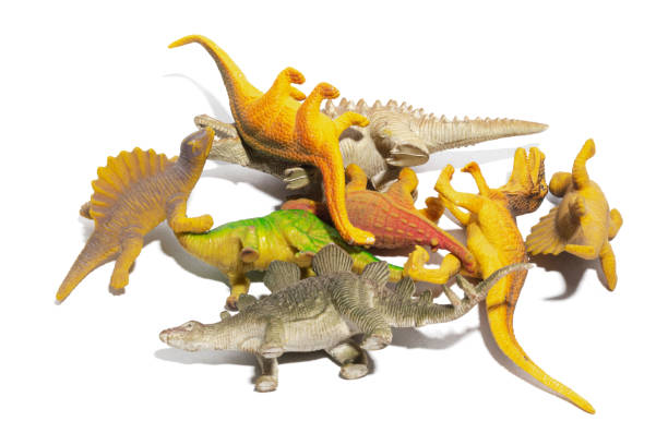 istock A group of some toy dinosaurs isolated on a white background. 1477869747