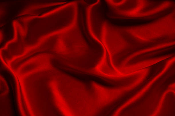 istock Red silk or satin luxury fabric texture can use as abstract background. 1477869948