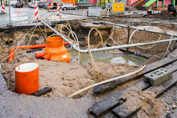 istock Replacement of underground communications pipes in the city street using a site dewatering system 1477875374