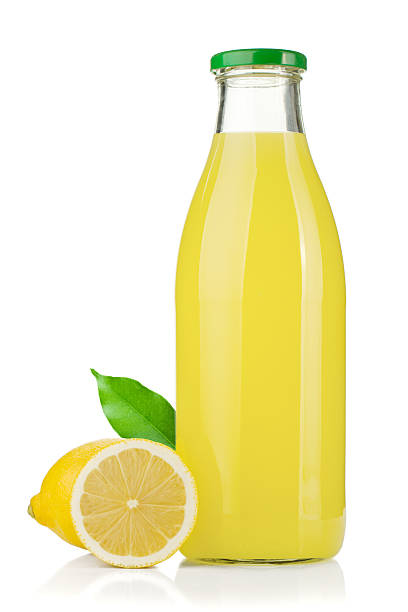 Bottle of lemon juice and fresh lemons