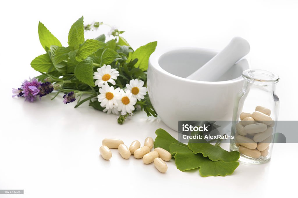 Alternative Medicine Healing herbs in mortar. Alternative medicine concept Homeopathic Medicine Stock Photo