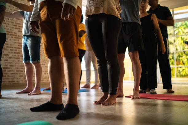 istock Low section of people in a relaxing group class 1477881345