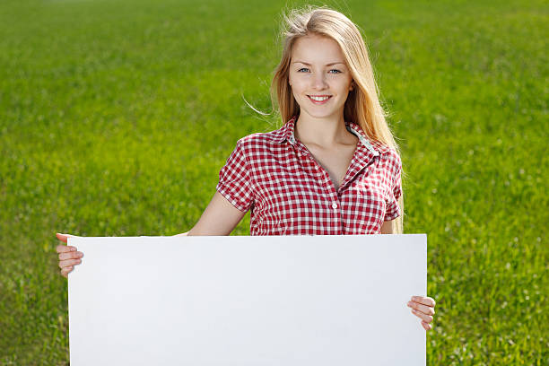istock Young female holding banner 147788265
