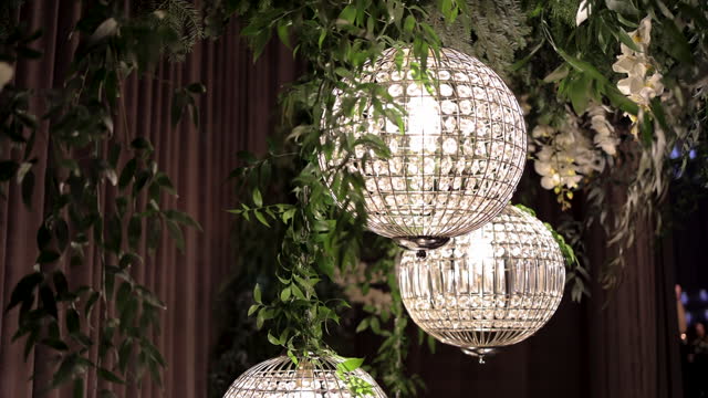 Luminous wedding decoration, shiny wedding chandelier with stones, lighting for wedding decor, Glittery chandelier detail, wedding decoration