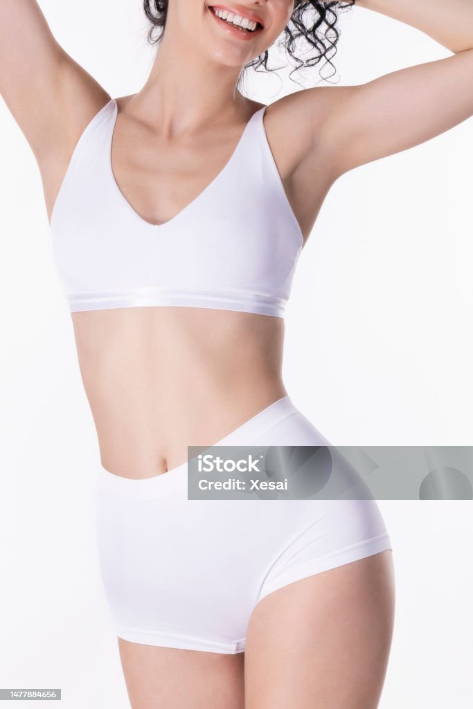 Shot Of An Attractive Young Woman Standing Alone In The Studio And Posing  In Her Underwear Stock Photo - Download Image Now - iStock