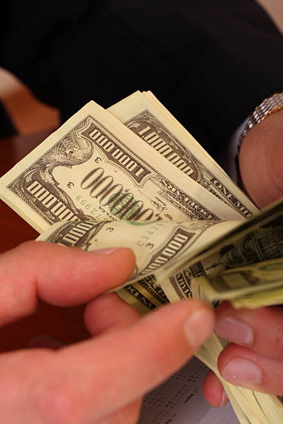 istock Men's hands, counted the money 147788566