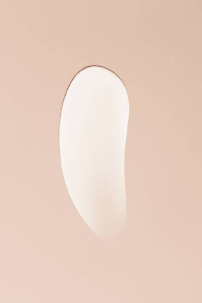 istock Close-up smear of cream texture on a beige background 1477886617