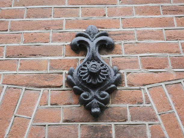 istock black painted cast iron wall anchor on a red brick wall 1477889541