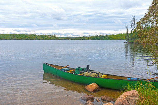 istock Canoe Ready on a Calm Lake 1477892508