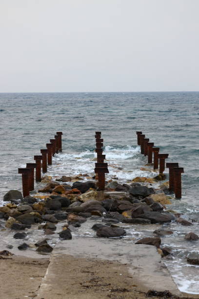 istock old, rusty abandoned and dismantled pier. sky space is empty. suitable for writing. 1477895532