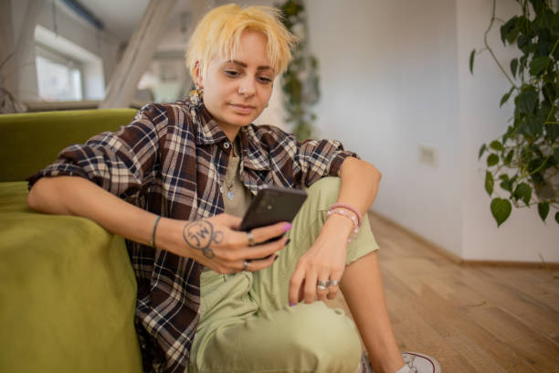 istock Happy young woman using phone 1477899244