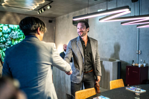 Businessmen greeting at the office