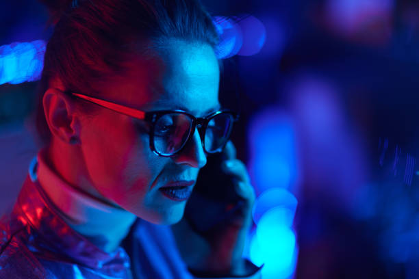 istock trendy woman in glasses using smartphone in modern office 1477901360