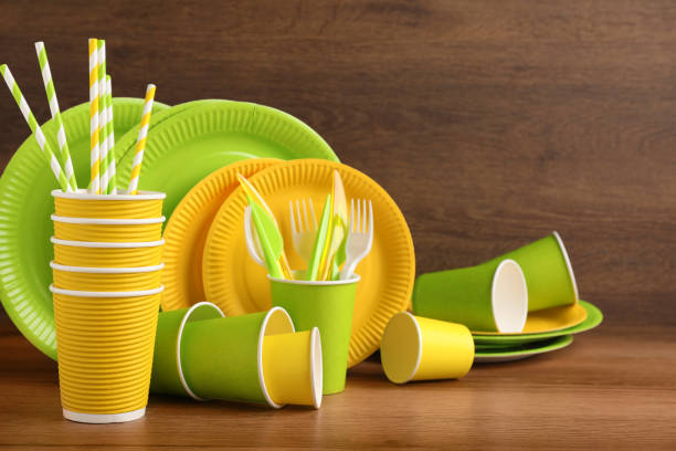 istock Set of bright disposable tableware on wooden table 1477902650