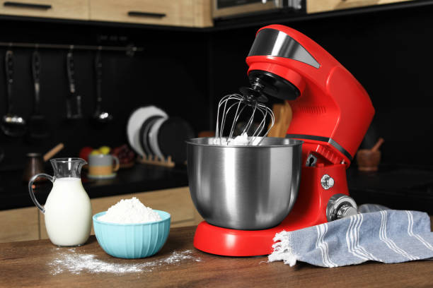 istock Modern red stand mixer and ingredients on wooden table in kitchen 1477902711