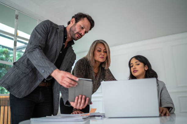istock Coworkers in a meeting at the office 1477903022