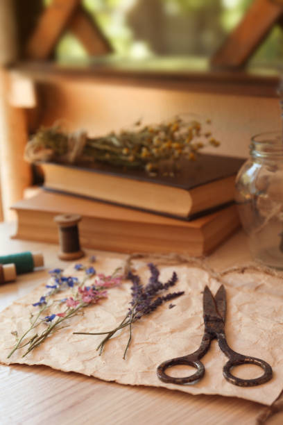 istock Composition with beautiful dried flowers and paper on wooden table 1477903941