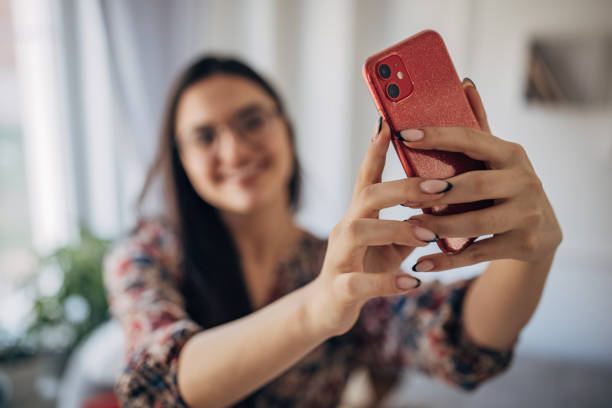 istock Woman taking a selfie 1477906388